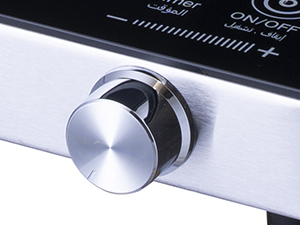 Close-up of the cooktop's silver control knob